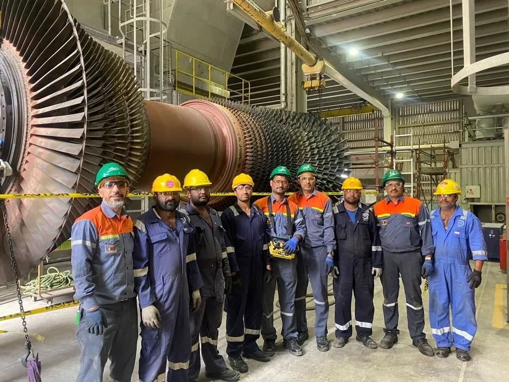 SAM Tech technical team at a power plant turbine hall
